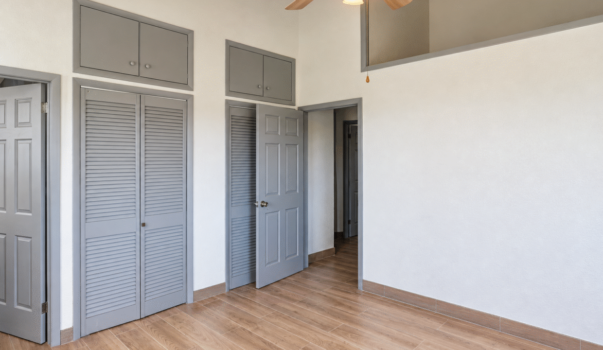 Clean Neutral Room with Loft Ledge and Closets